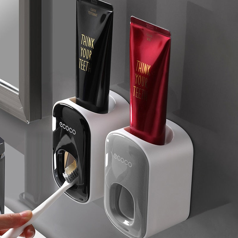 Wall-mounted automatic toothpaste dispenser.