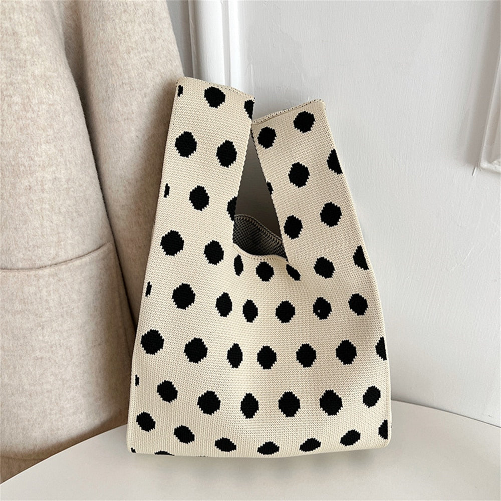 Polka dot stripe knit handbag.