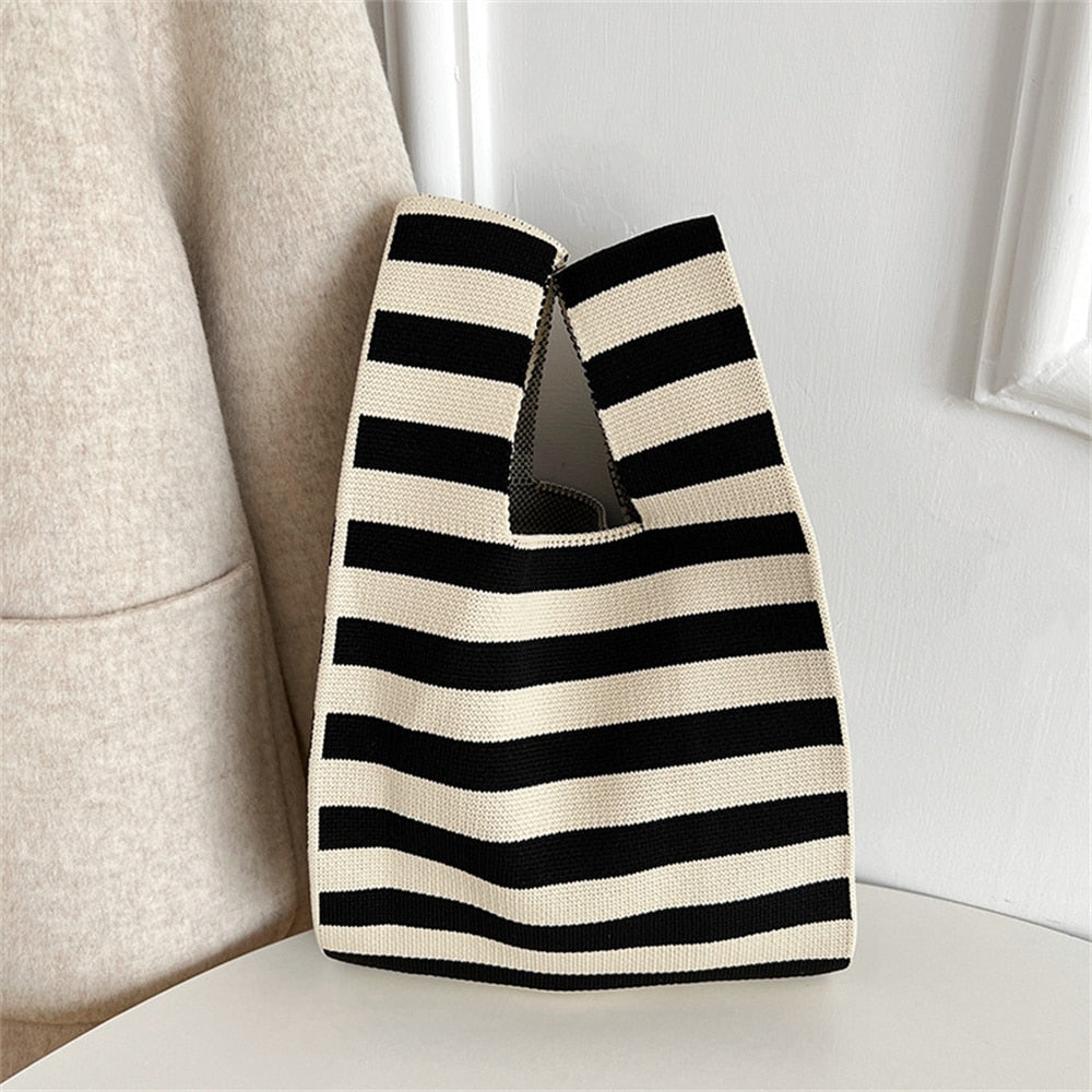 Polka dot stripe knit handbag.