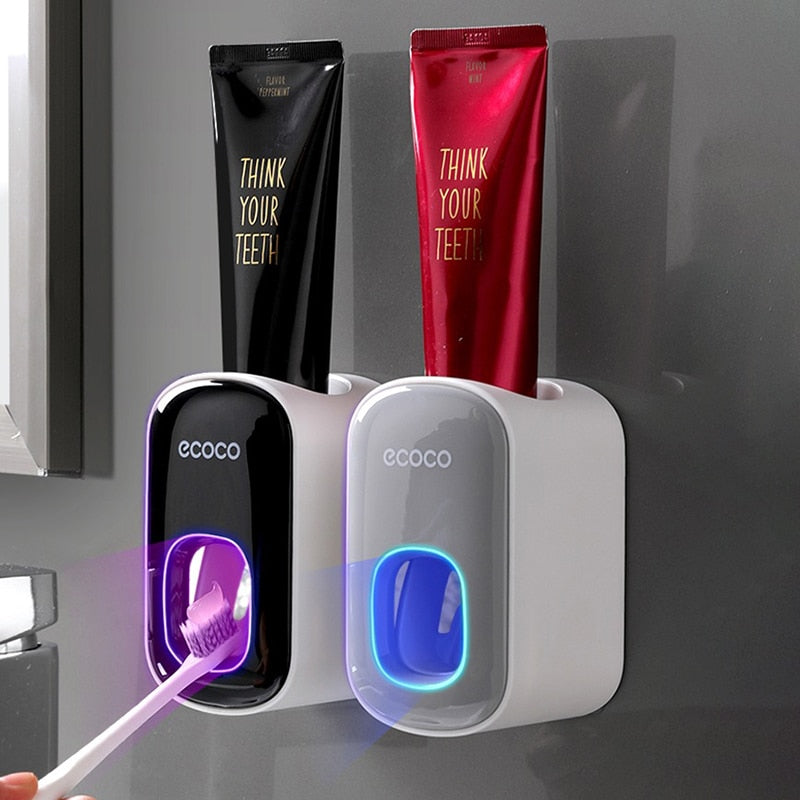 Wall-mounted automatic toothpaste dispenser.