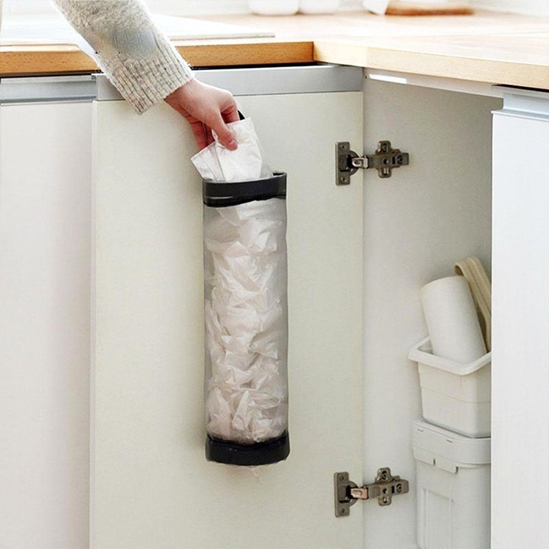 Wall-mounted plastic bag dispenser.